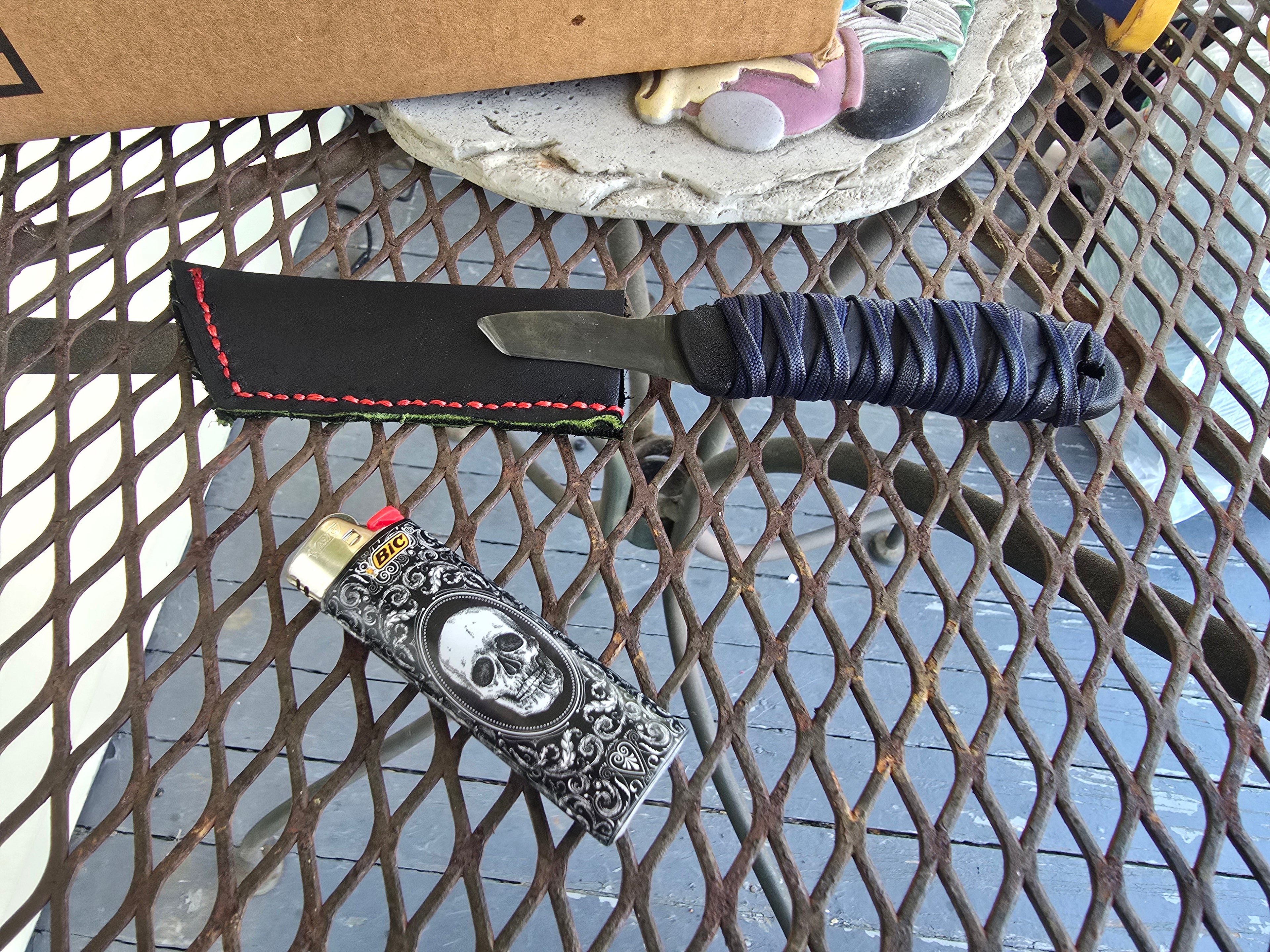 Modified micro tanto utility knife with leather slip